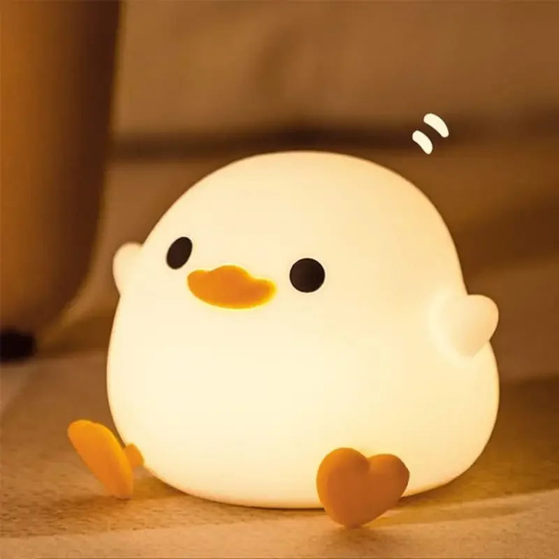 Cute chick-shaped kawaii night light on a soft brown background