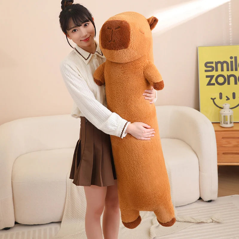 Person holding a large brown kawaii plush toy in a living room.