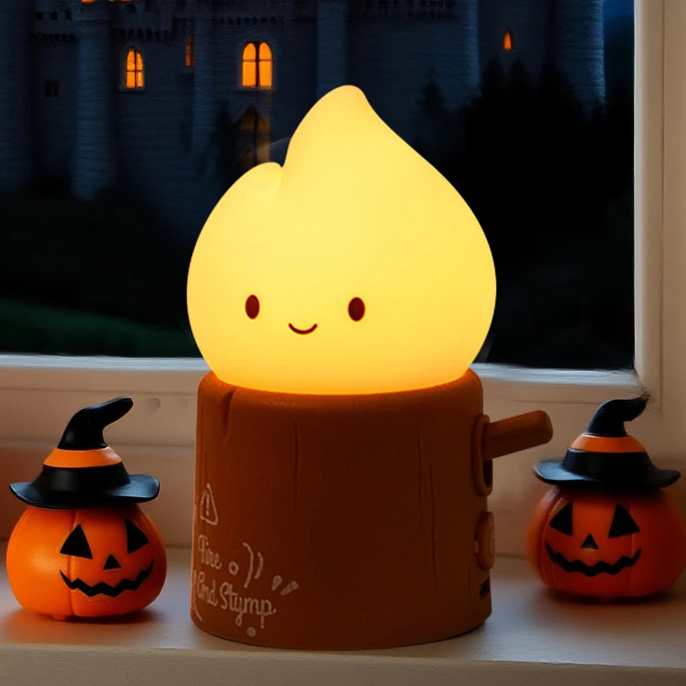Candle-shaped kawaii night light with pumpkins on a windowsill at night