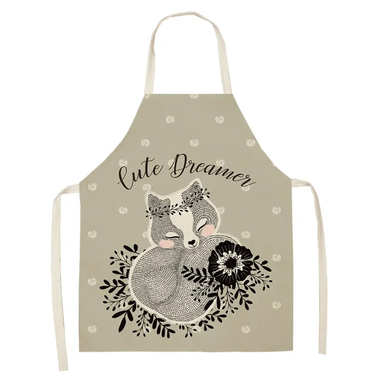 Kawaii apron with fox design and 'Cute Dreamer' text on a beige background