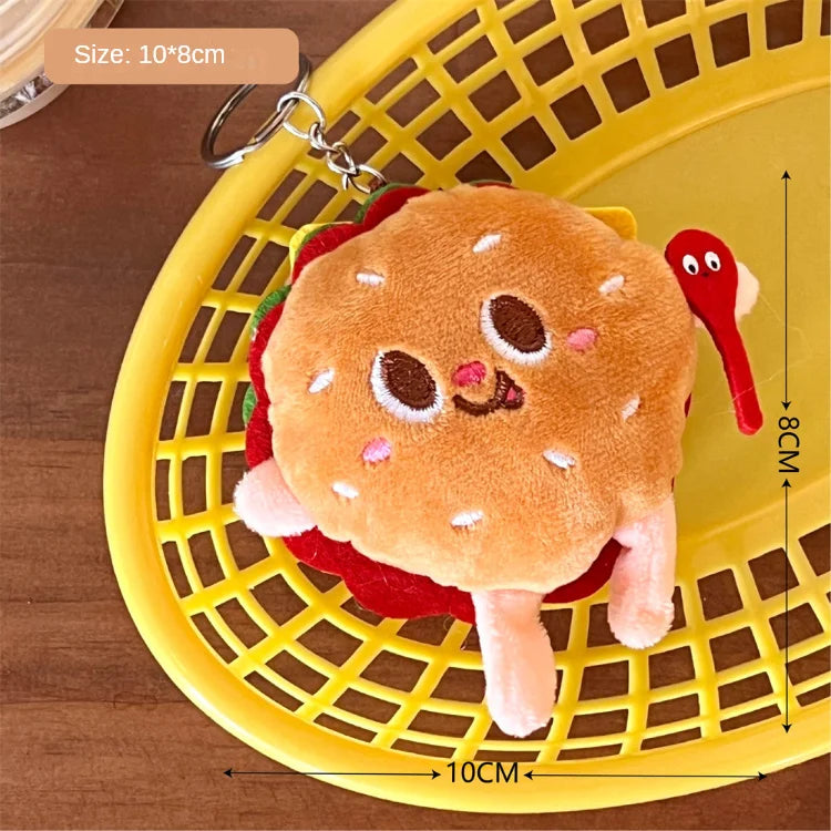 Plush kawaii hamburger keychain on a yellow basket with measurements indicated.