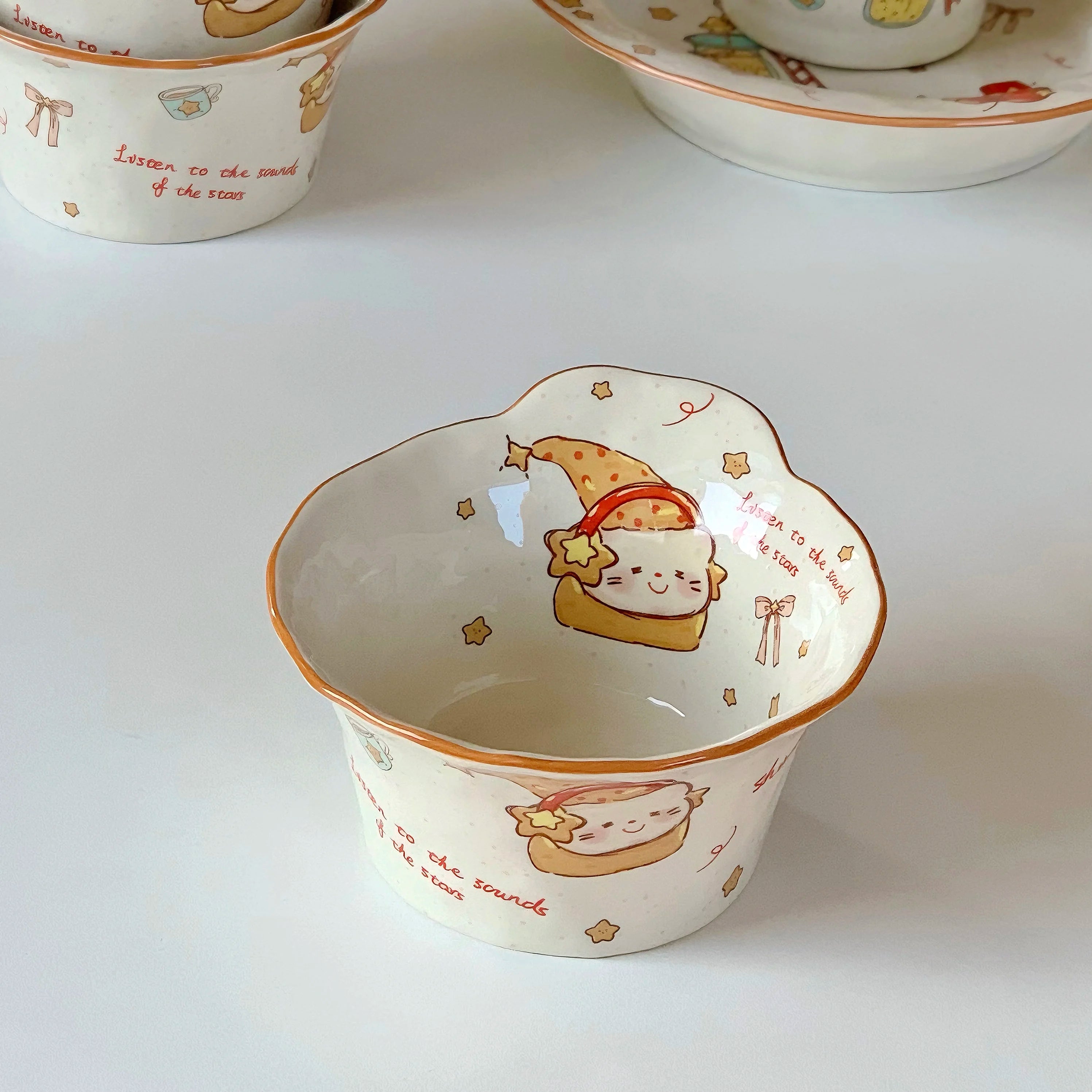 Ceramic kawaii ramen bowl with cartoon cat design on a white background