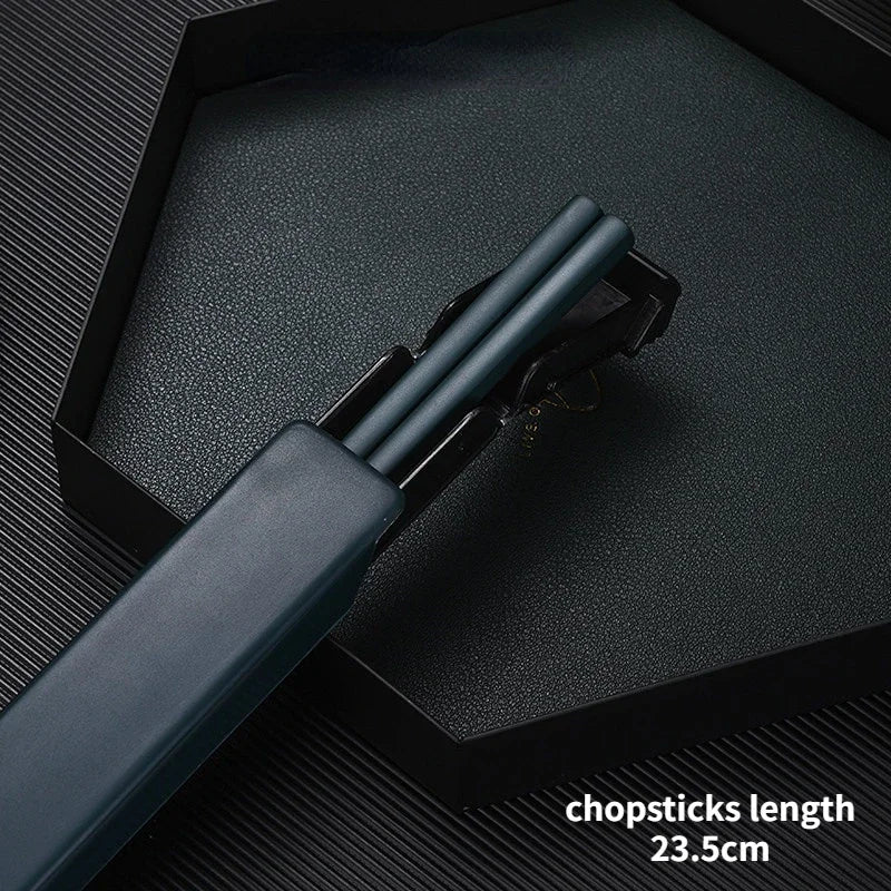 Pair of black kawaii chopsticks with a case on a dark textured surface, showing the length measurement.