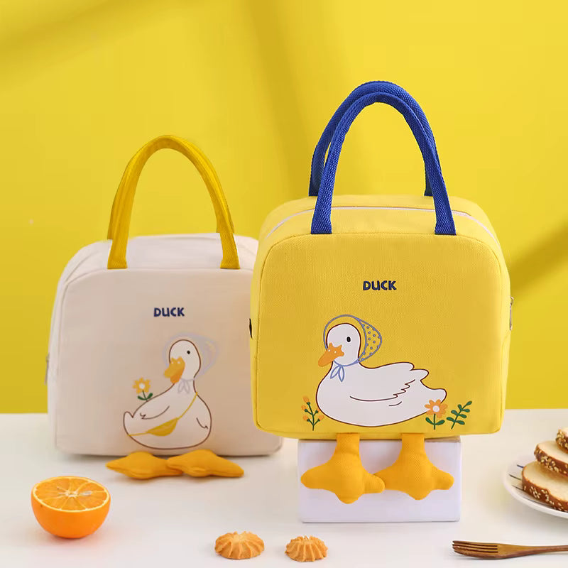 Two lunch bags with duck designs on a yellow background