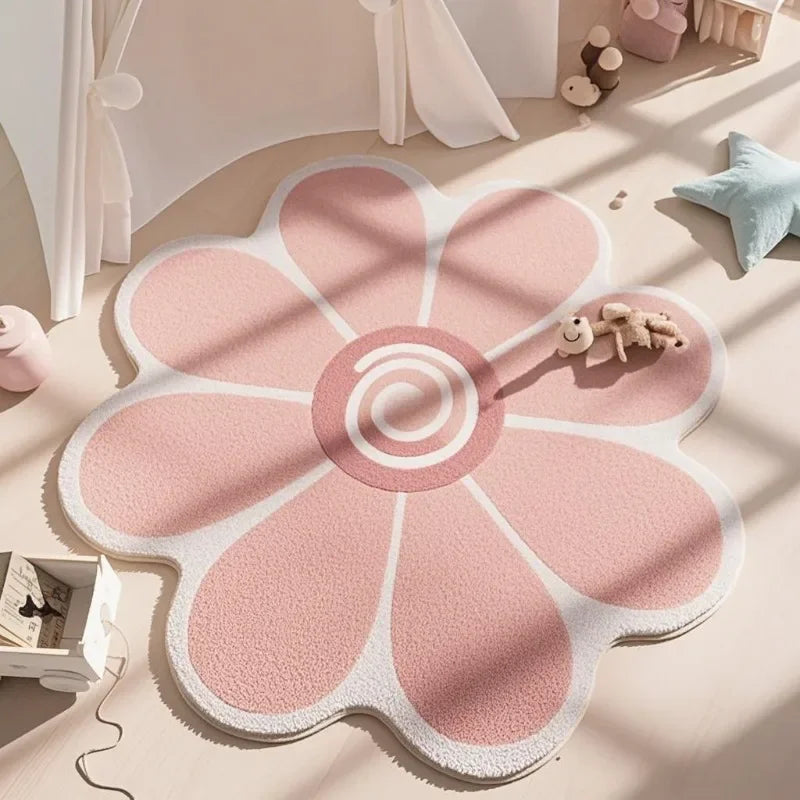 Pink flower-shaped kawaii rug on a light wooden floor with toys around