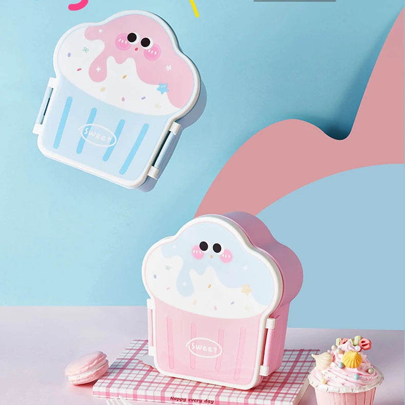Cute cartoon-style cloud-shaped kawaii lunch box on a checkered tablecloth with a blue background