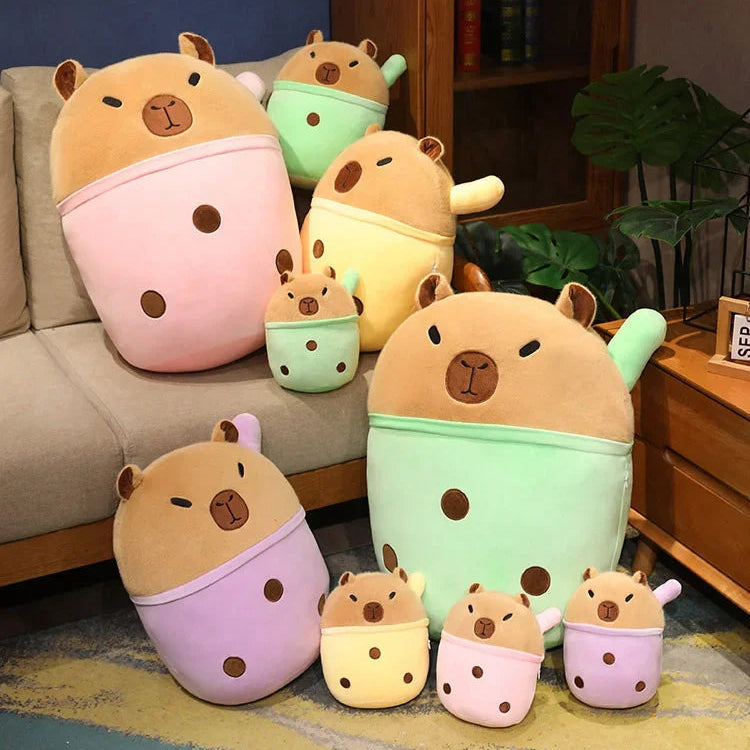 Set of cute kawaii animal-shaped cushions in various colors on a sofa.