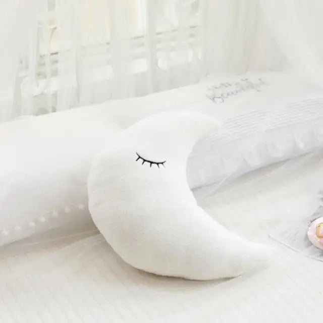White kawaii plush toy with a face on a white background