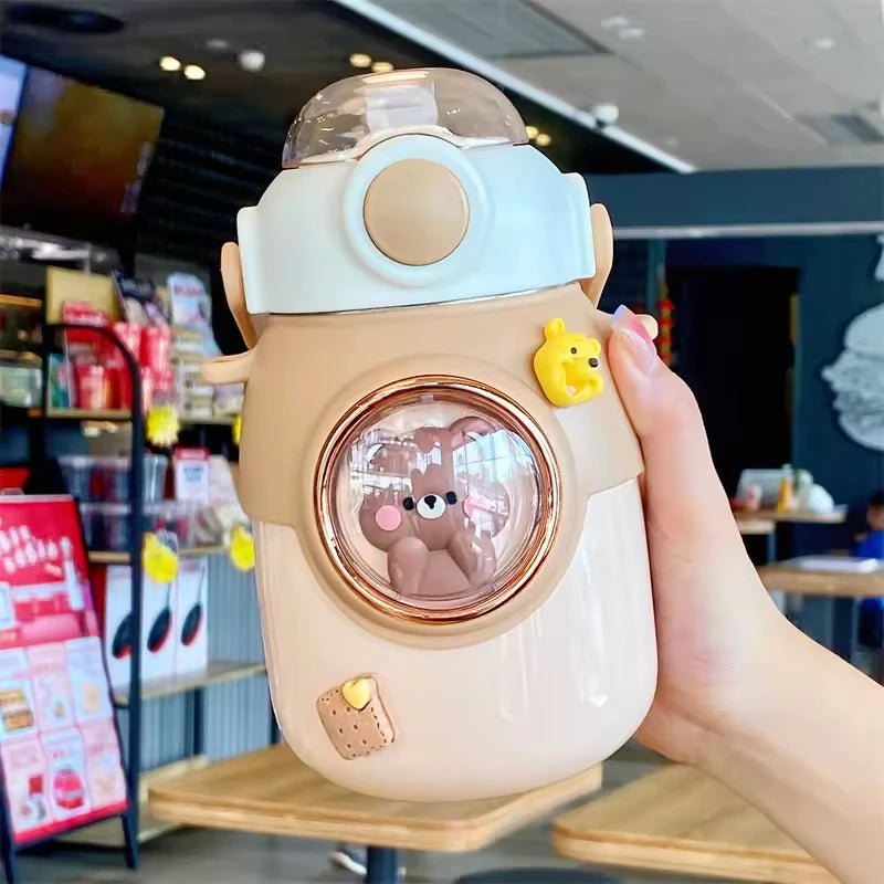 Cute cartoon-style kawaii water bottle held by a hand in a casual setting