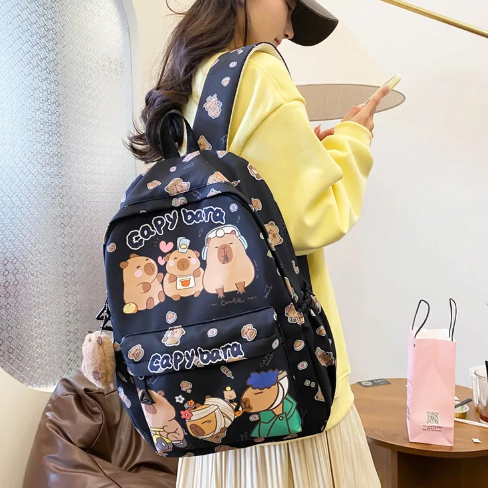 Person wearing a Kawaii cartoon-themed backpack with a polka dot pattern