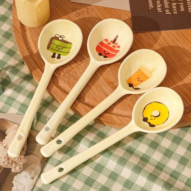 Four fruit designed kawaii spoons on a kitchen table