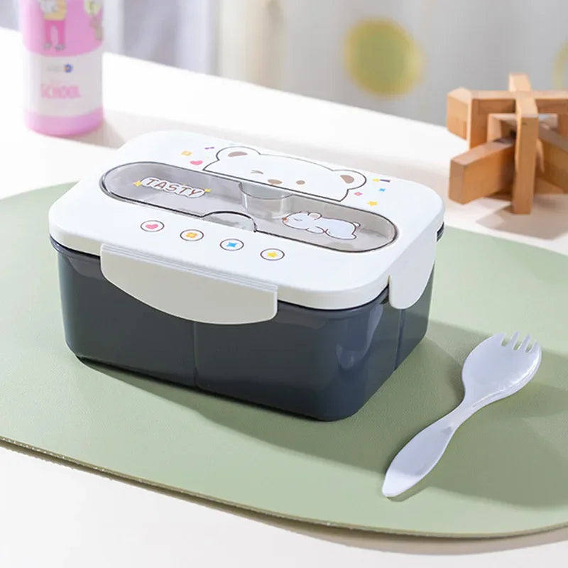 Lunch box with kawaii cartoon design on a green tray with a fork
