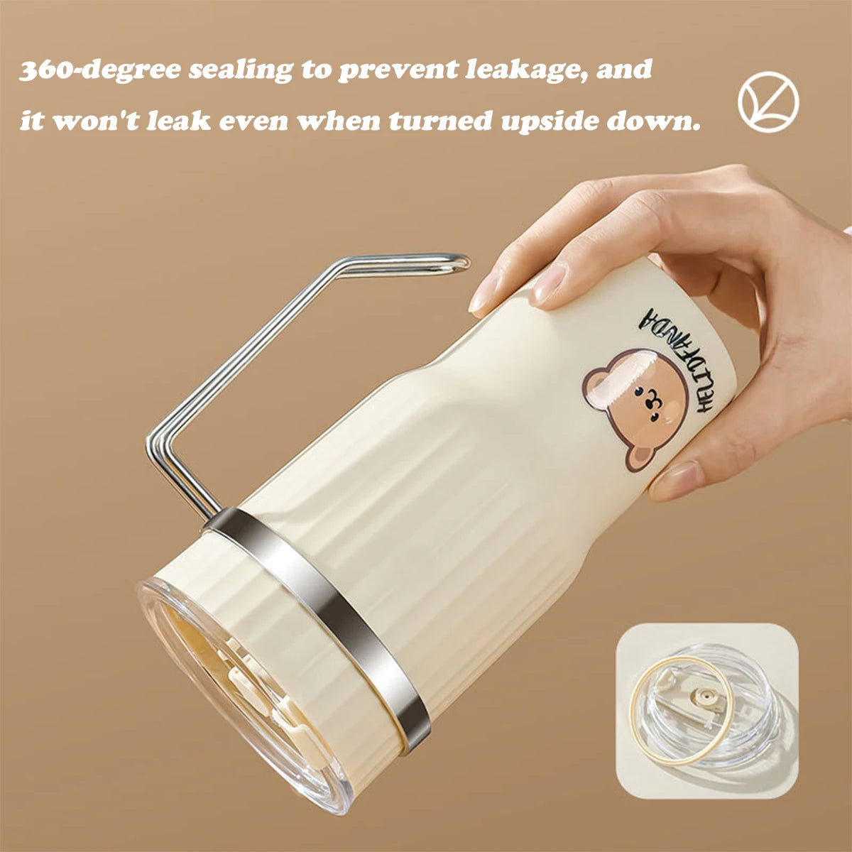 Beige insulated kawaii tumbler with a handle, held by a hand, on a beige background.