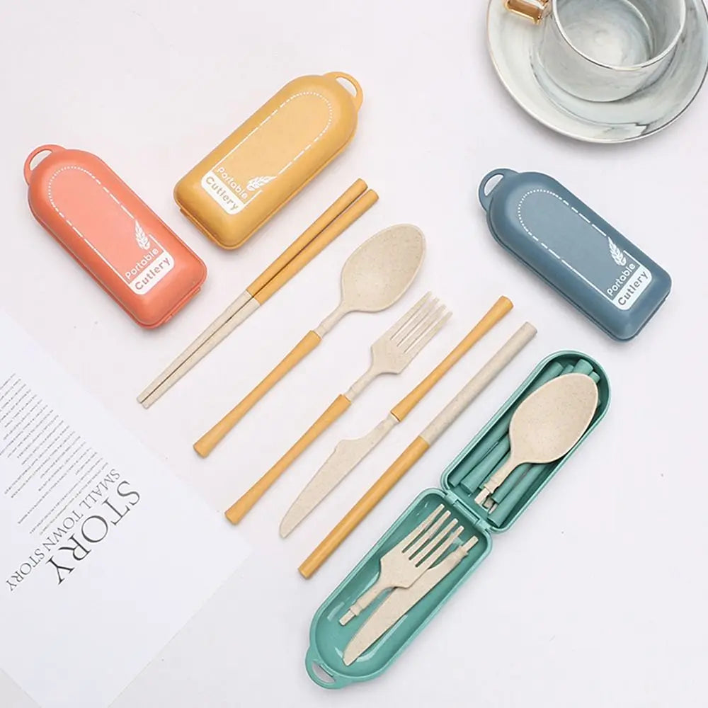 Set of portable kawaii utensils and containers on a white surface
