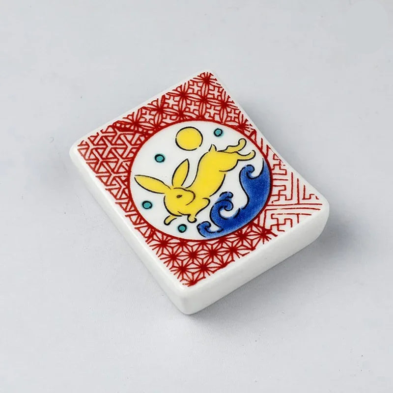 A square kawaii chopstick holder with a rabbie design
