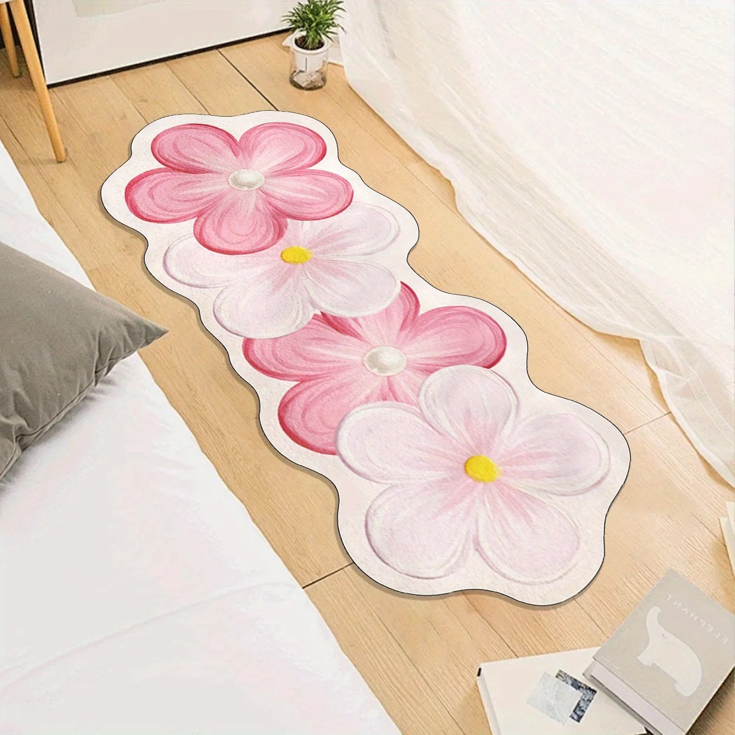 Floral design kawaii rug on a wooden floor with a bed and window in the background