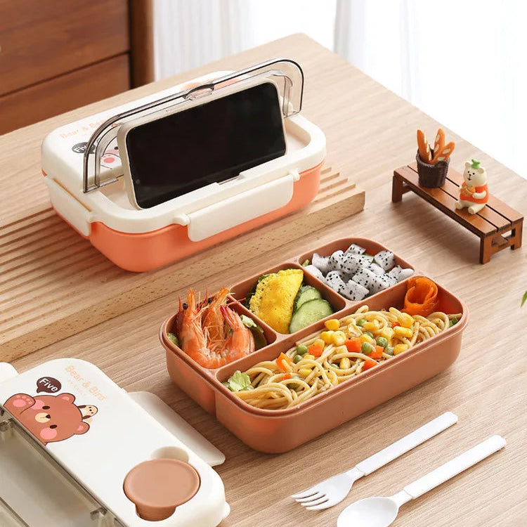 Kawaii bento box with compartments filled with food on a wooden table