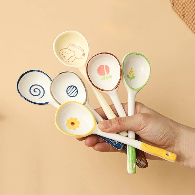 A person holding a set of kawaii spoons