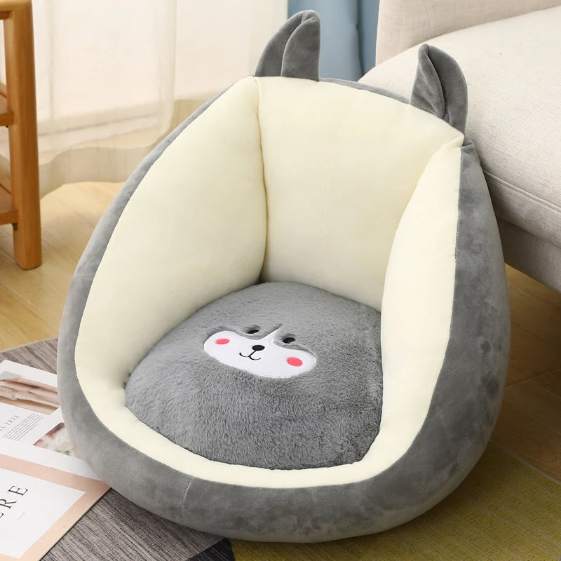Plush animal-shaped kawaii cushion with a cute face design on a wooden floor.