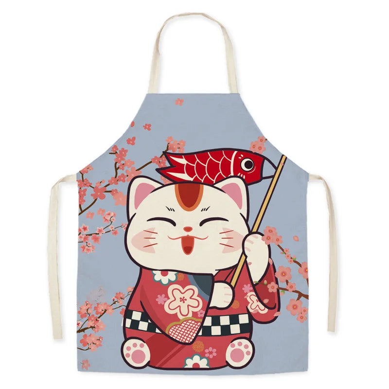 Kawaii apron with a cartoon cat holding a fish and cherry blossoms on a light blue background