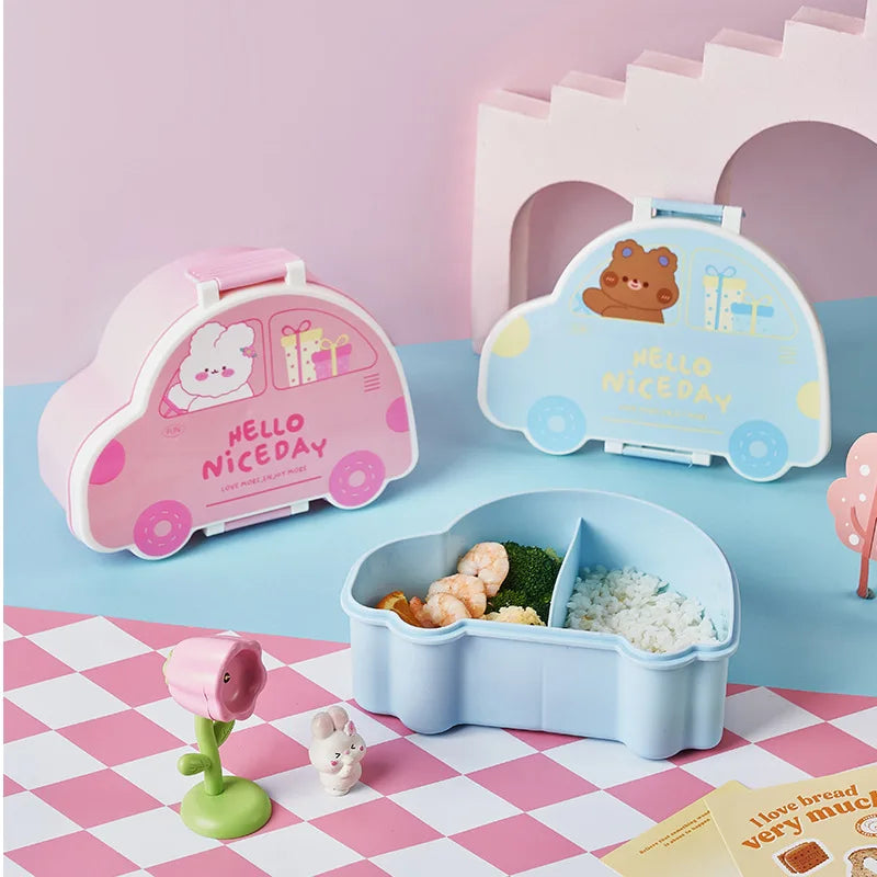 Children's kawaii lunch box set with pink car-shaped container, blue bear-shaped container, and small toys on a checkered tablecloth.