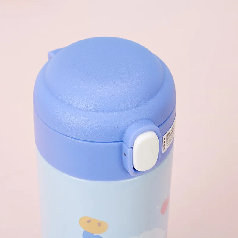 Blue kawaii water bottle with a white button on a light pink background
