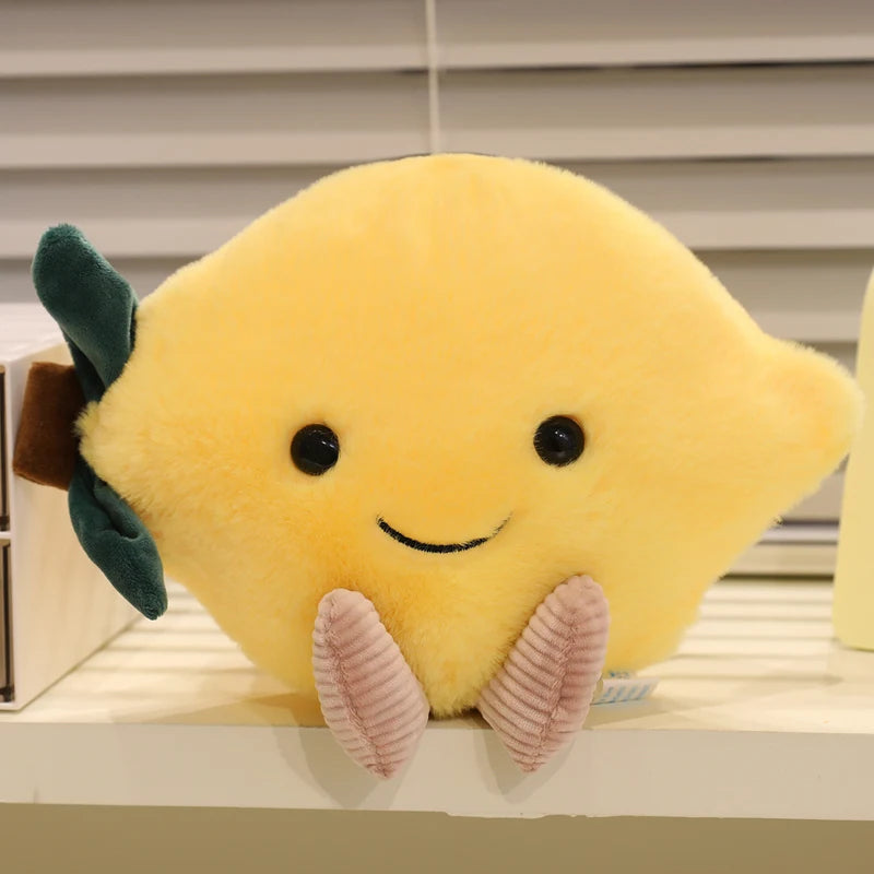 Kawaii plush toy shaped like a lemon with a smiling face on a shelf.