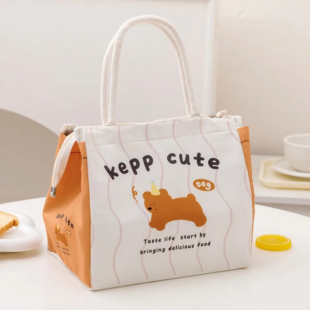 Cute cartoon-themed kawaii lunch bag with a dog illustration on a white surface.