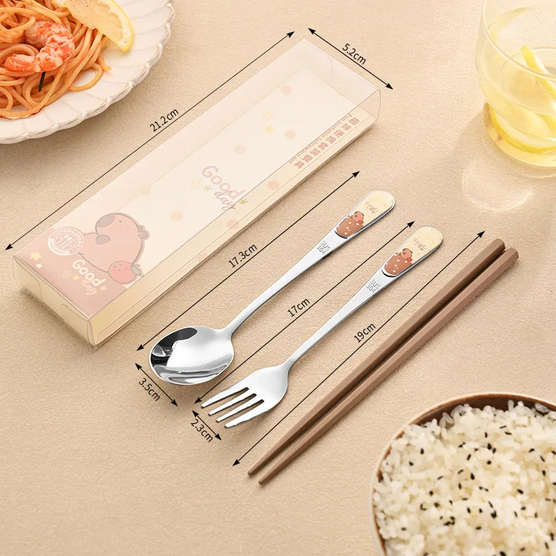 Stainless steel kawaii utensils set with dimensions on a beige surface, including a spoon, fork, and chopsticks.