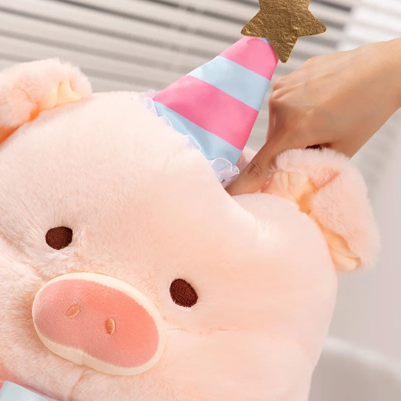 A close up of a kawaii pig plush toy and a person pressing their finger into it