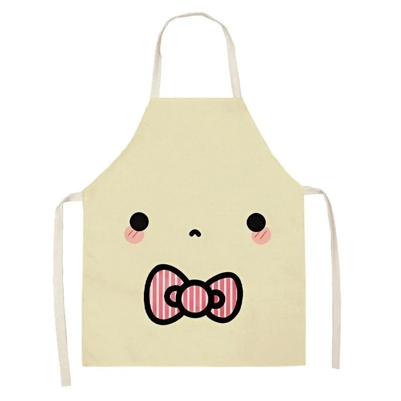 Beige kawaii apron with a cartoon face and bow design on a white background