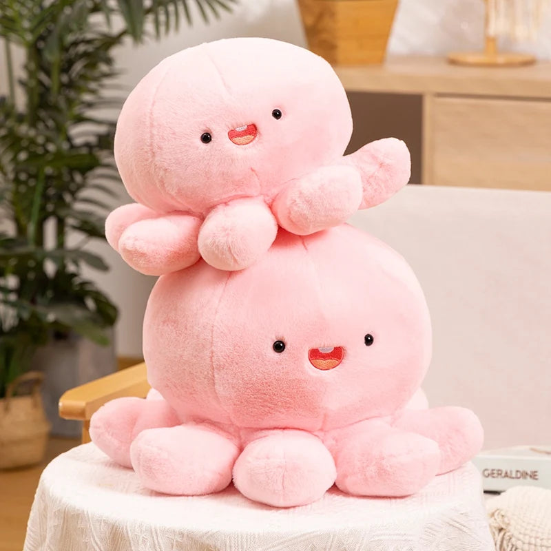 Two pink kawaii plush toys stacked on a chair with a plant and furniture in the background