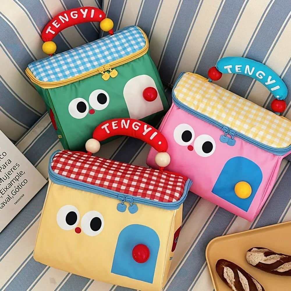 Three colorful house-shaped kawaii bags with face designs on a striped background