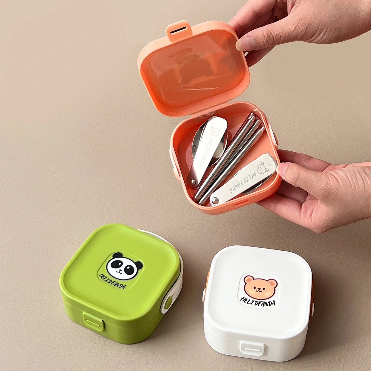 A set of three kawaii utensils in different colors