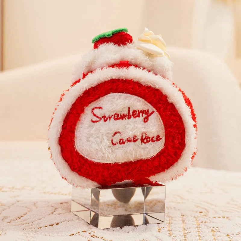 Kawaii strawberry cake plush toy on a stand with a soft blurred background