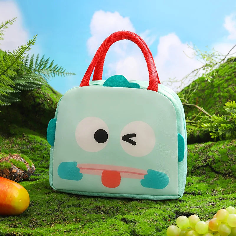 Cute cartoon-style kawaii lunch bag with a red handle on a grassy outdoor background