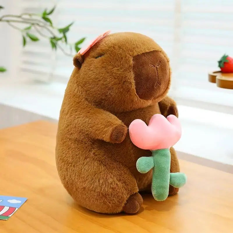 Kawaii plush toy groundhog holding a pink tulip on a wooden surface with a blurred background