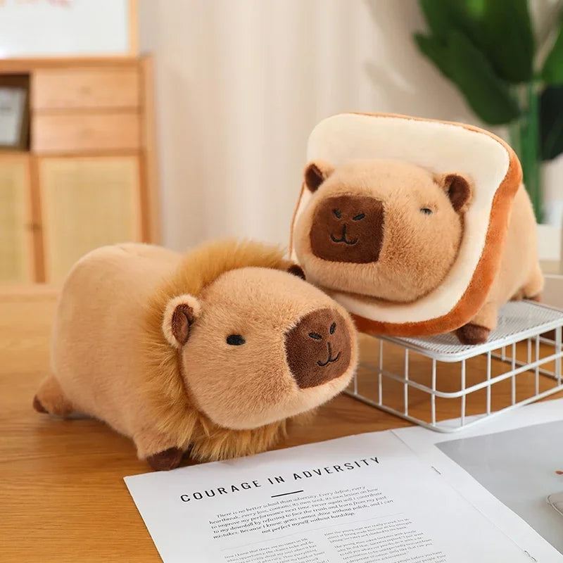 Two kawaii plush toys resembling a lion and a bear in a toast-like shape on a desk.