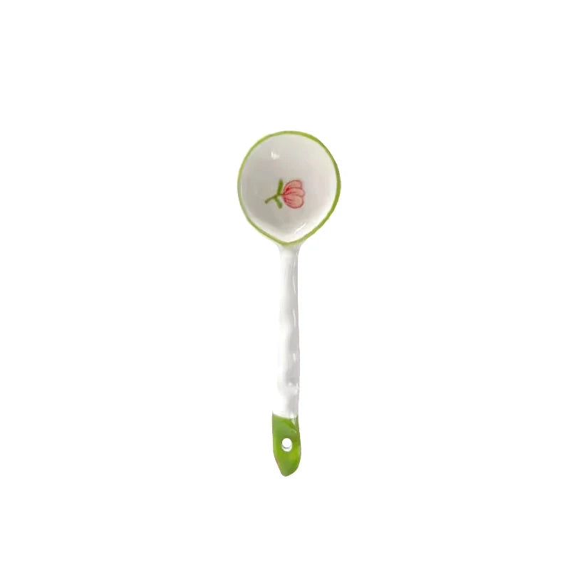 A white and green kawaii spoon on a white background