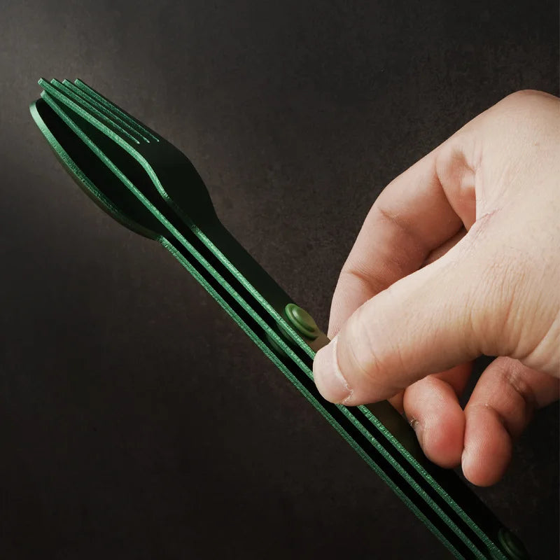 Someone holding a set of green kawaii utensils