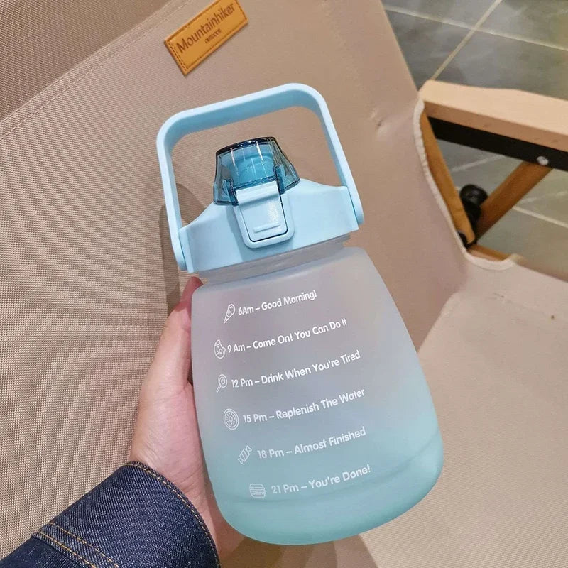 Light blue kawaii water bottle with motivational text held by a person, brand 'Mountainbike' visible in the background.