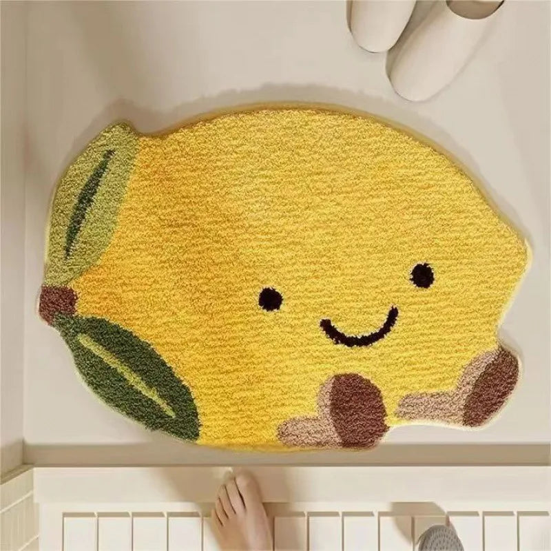 Yellow lemon-shaped kawaii doormat with a smiley face on a white floor.
