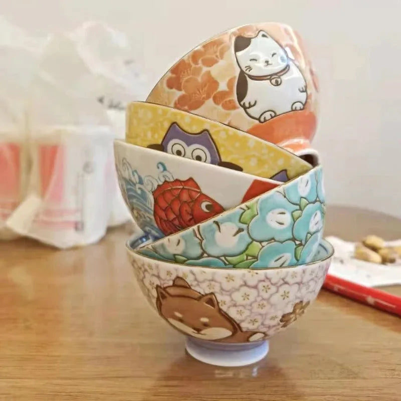 Five stacked kawaii bowls on a table