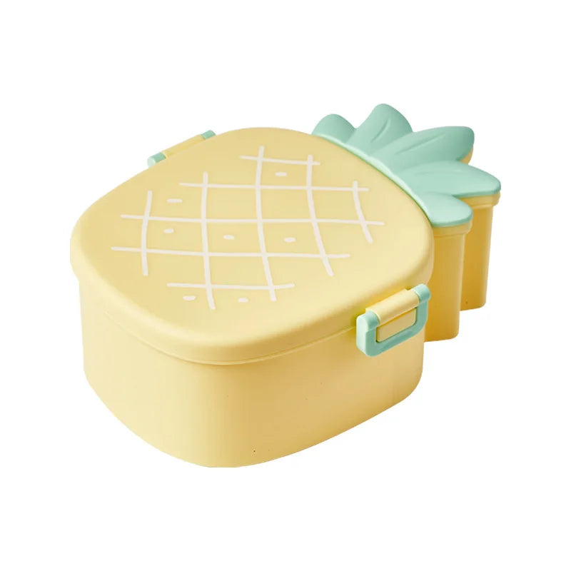 Yellow kawaii bento box shaped like a pineapple with a green lid on a white background