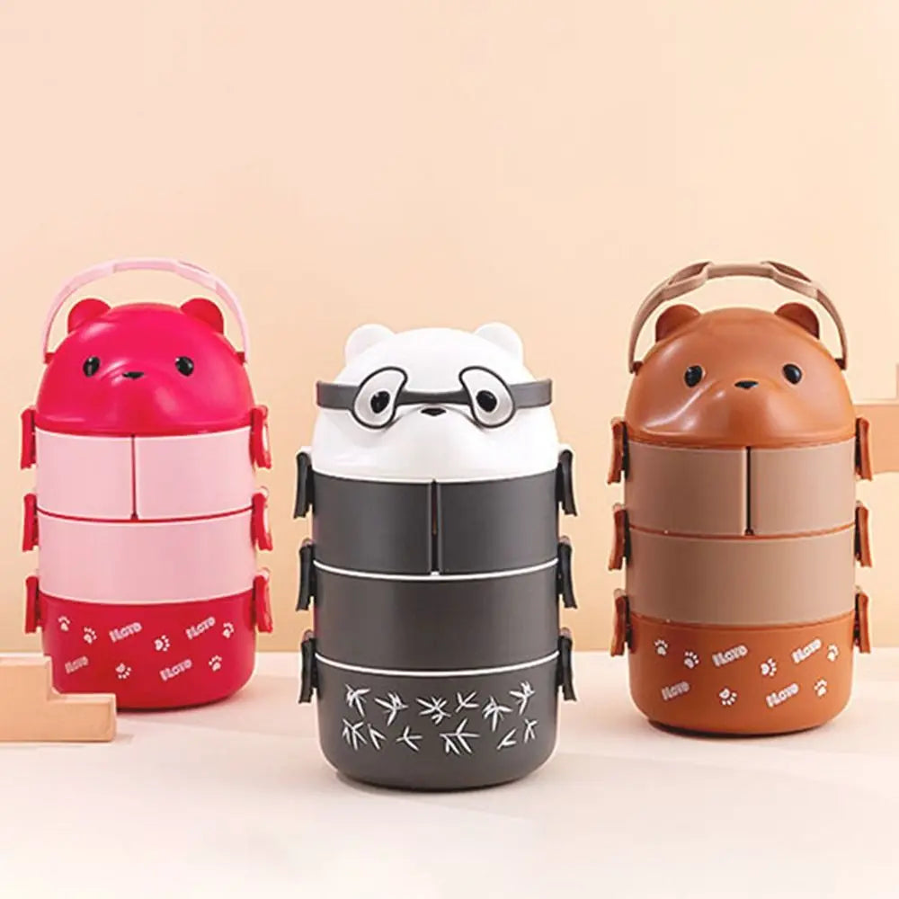 Three cartoon-style kawaii lunch boxes in red, white, and brown on a beige background