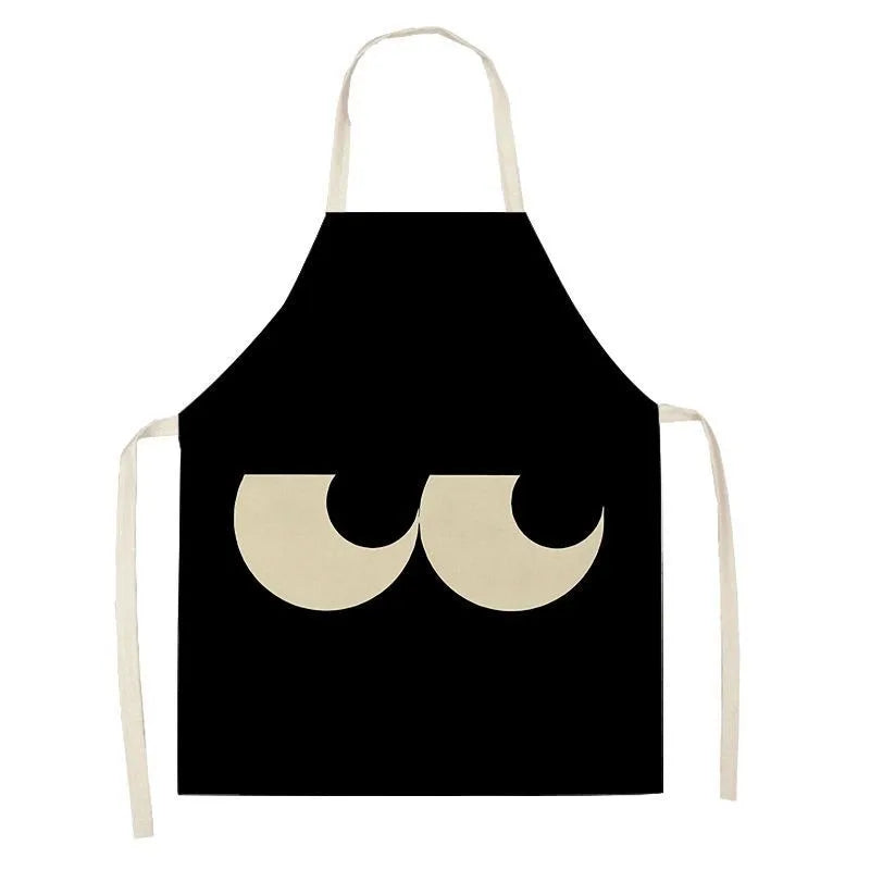 Black kawaii apron with a white graphic design on a white background