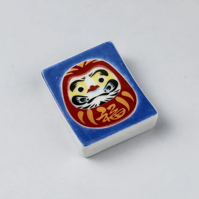A square shaped kawaii chopstick holder with a lion design