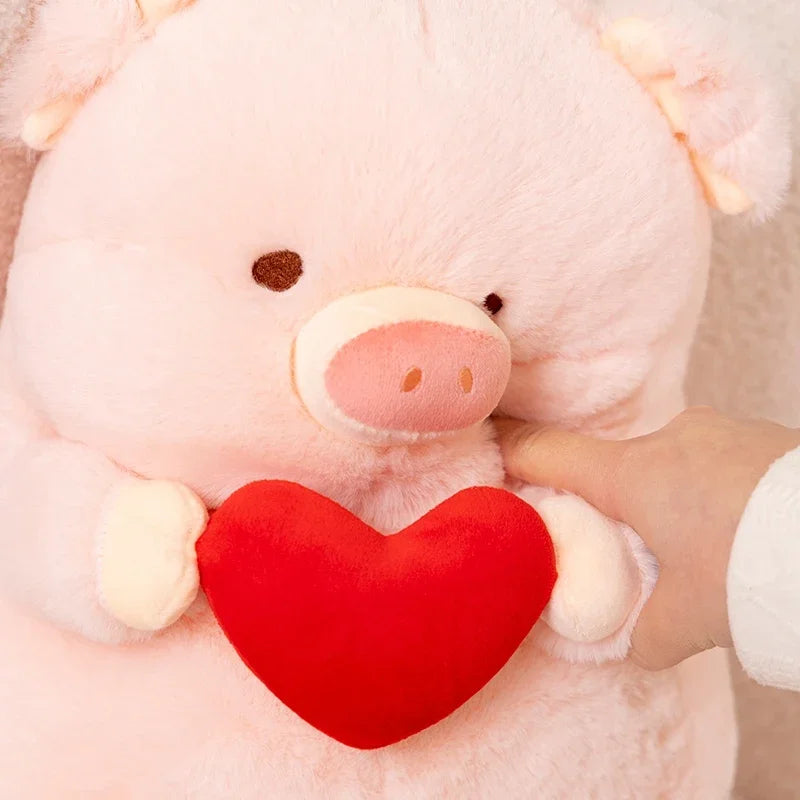Close up of a pink kawaii pig plushy being squeezed