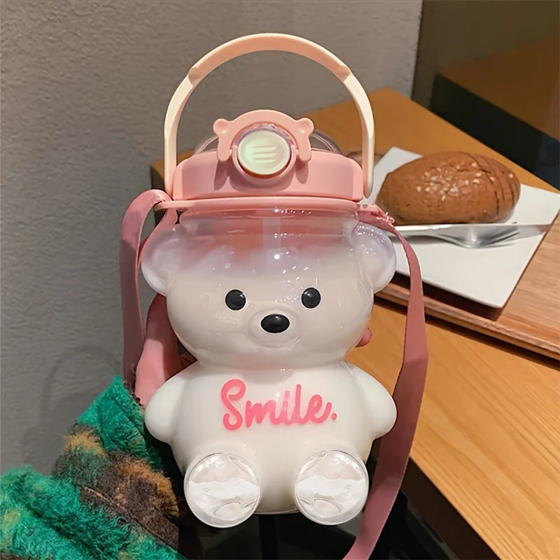 Pink bear-shaped kawaii water bottle with 'Smile' text on a table