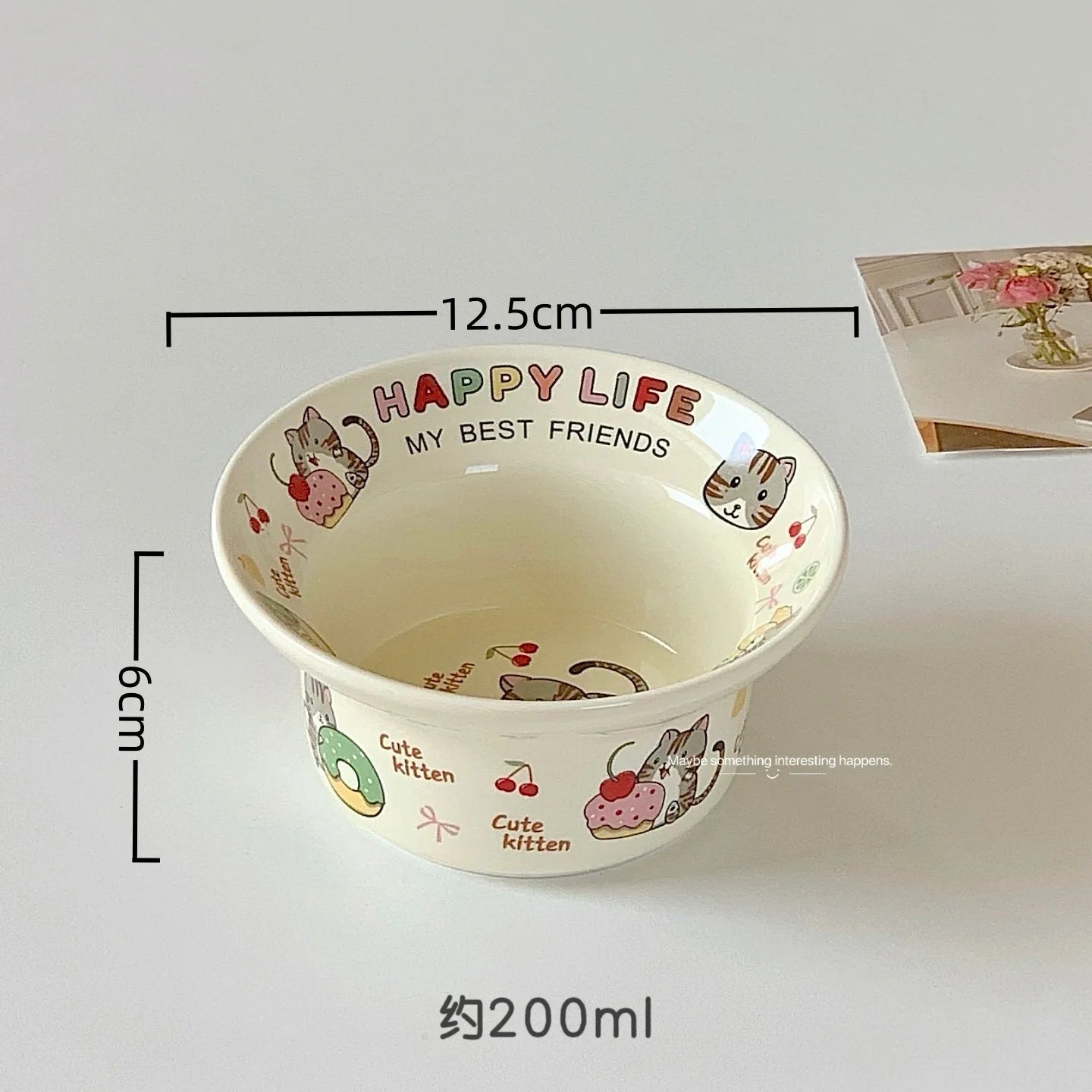 Ceramic kawaii ramen bowl with cat illustrations and text, shown with measurements on a light background